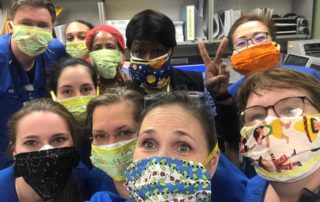 Heroes wearing binkies of love on their faces